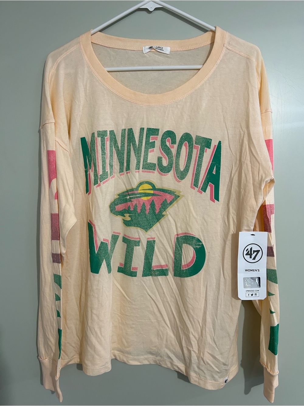 47 Women's Minnesota Wild Peach Long Sleeve Shirt with Green & Pink Print